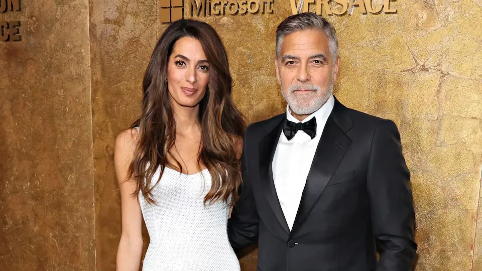 George and Amal Clooney with their children, a symbol of family commitment